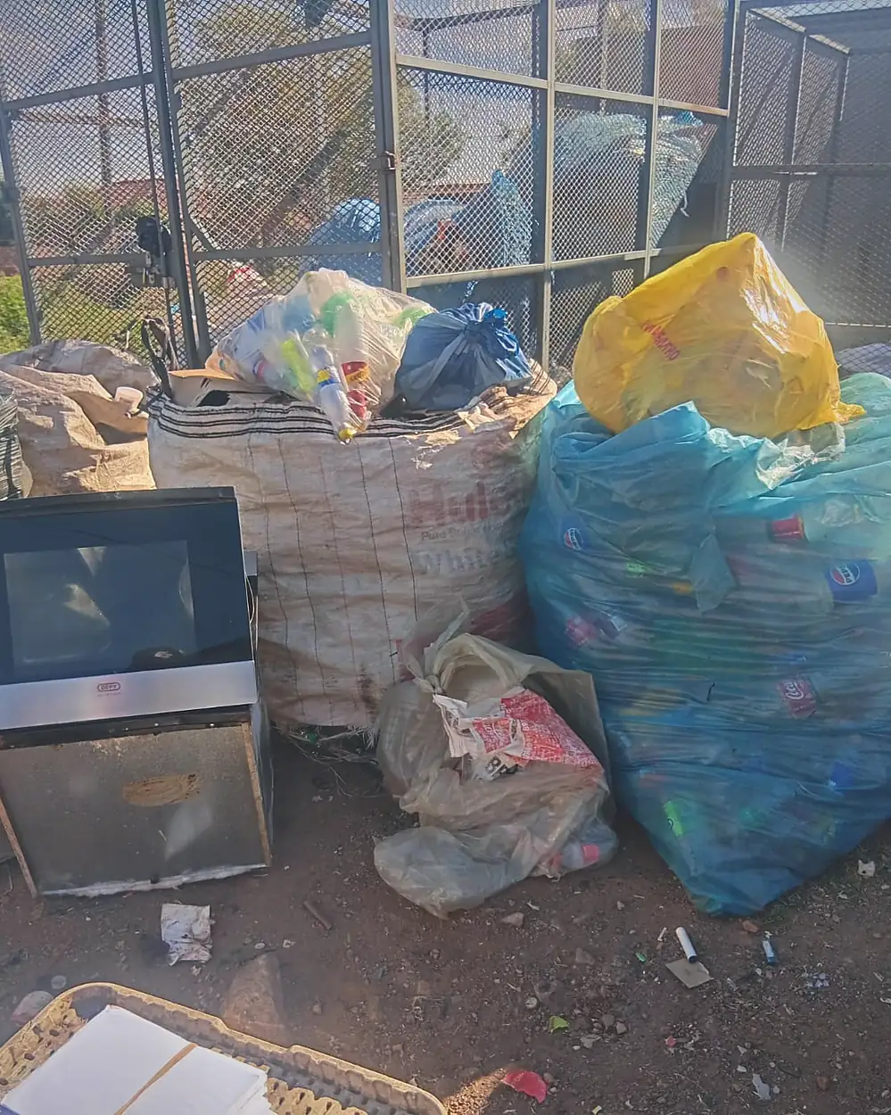 Separated household recycling in coloured bags at the Murero sorting site.