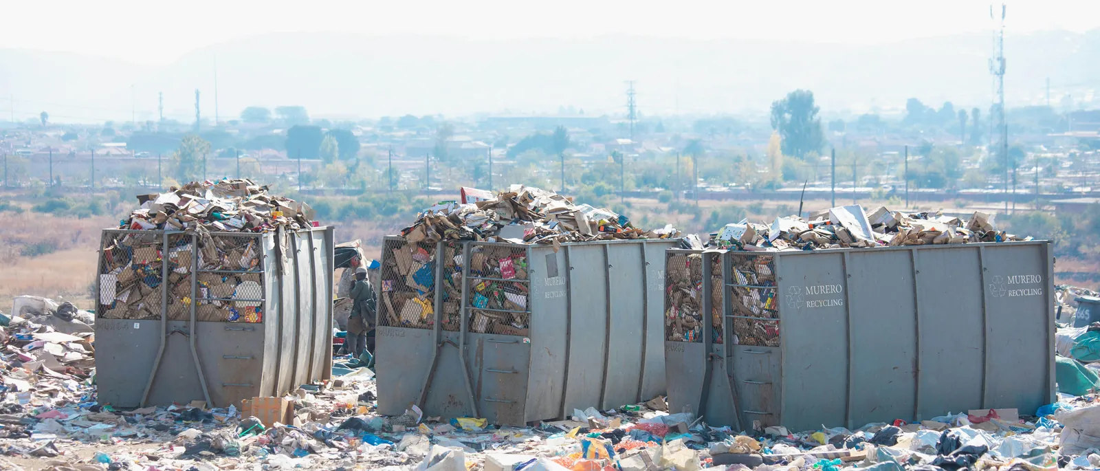 A row of Murero mesh cages filled with sorted recyclable material at a Murero site.